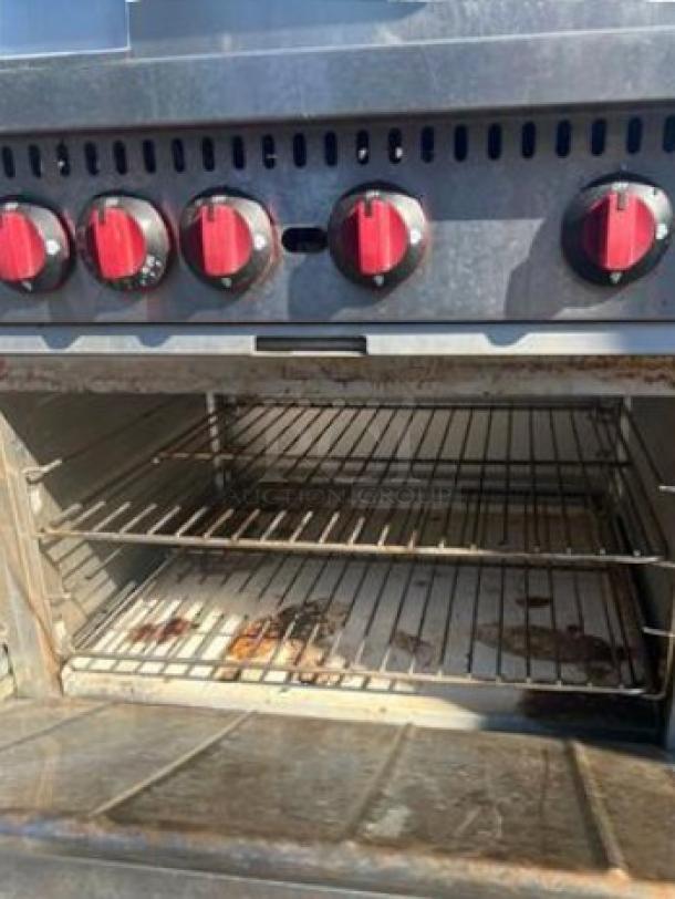 6-burner commercial gas range with standard oven, red knobs, natural gas, Commercial Restaurant Equipment, fully tested, great condition.
