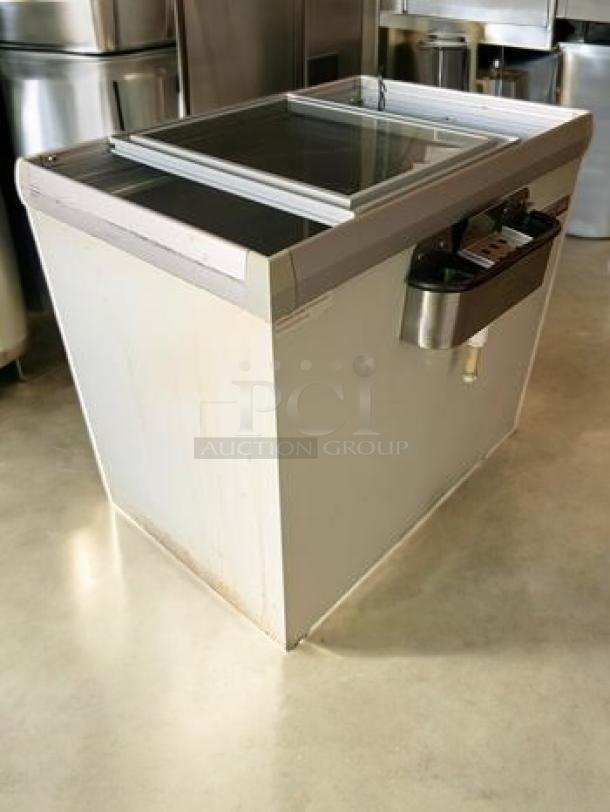 Commercial sliding glass top chest freezer, excellent condition, 115V, fully tested, ideal for ice cream or beverages.