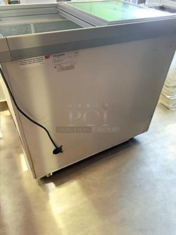 Outstanding condition commercial sliding glass top ice cream/beverage freezer, 115V, fully tested, retail/restaurant grade.