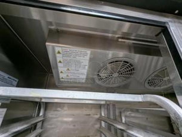 Turbo Air TSF-49SD-N Super Deluxe Reach-In Freezer interior, dual fans, metal racks, warning labels visible, excellent condition.