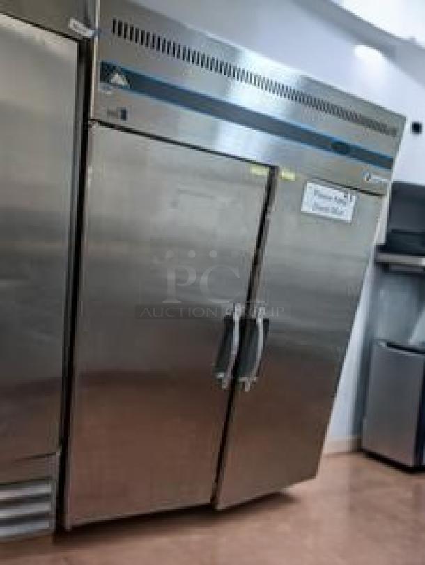 Everest ESR2 49" reach-in refrigerator with dual solid doors, top-mounted compressor, in immaculate condition, fully tested.
