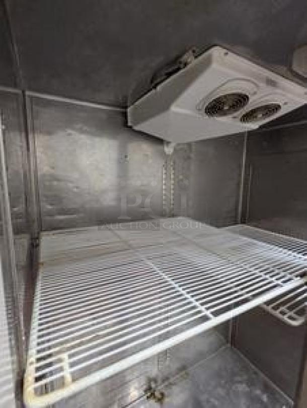 Everest ESR2 49" reach-in refrigerator interior with wire shelving, top-mounted compressor, in immaculate condition.