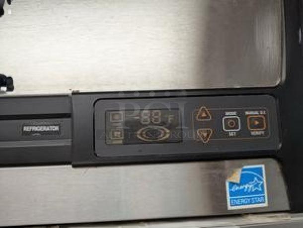 Alt text: Randell R4S-6 control panel showing digital temperature display, energy efficiency sticker, and control buttons.