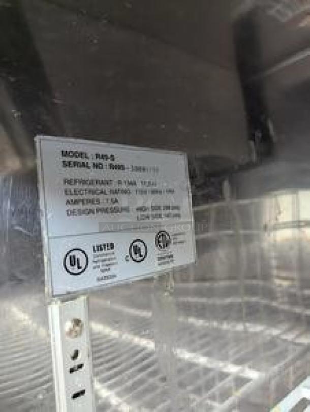 Tag showing Randell R4S-6 model and specifications on double door reach-in refrigerator, excellent condition.