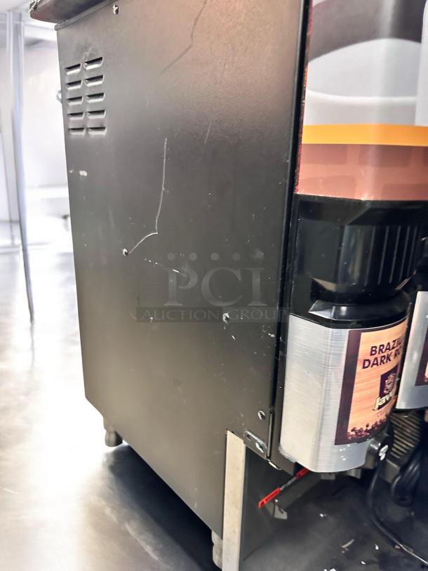 Flawless Bunn LCA-2 PC dual flavor dispenser. Black exterior, slight wear. Labels: "Brazil Dark Roast." Fully tested, 120V.