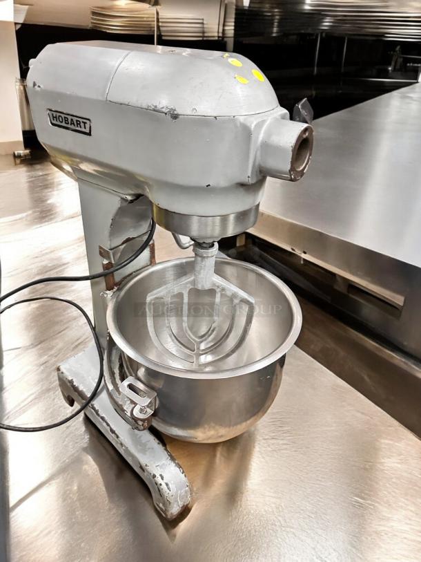 Hobart commercial planetary mixer in outstanding condition, 115V, fully tested and working, features a sturdy stainless steel bowl.