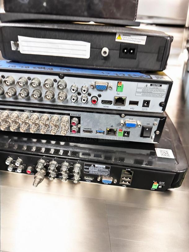 Auction item: POS Caller ID & DVR System Bundle in outstanding condition. Features include basic POS Caller ID (4-line), multi-channel network DVRs, and Ethernet to RCA converter. Fully tested and working with visible connection ports and labels.