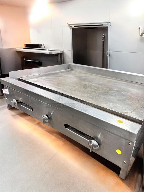 Commercial grade 36" stainless steel flat top gas griddle, superb condition, fully tested, dual control knobs.