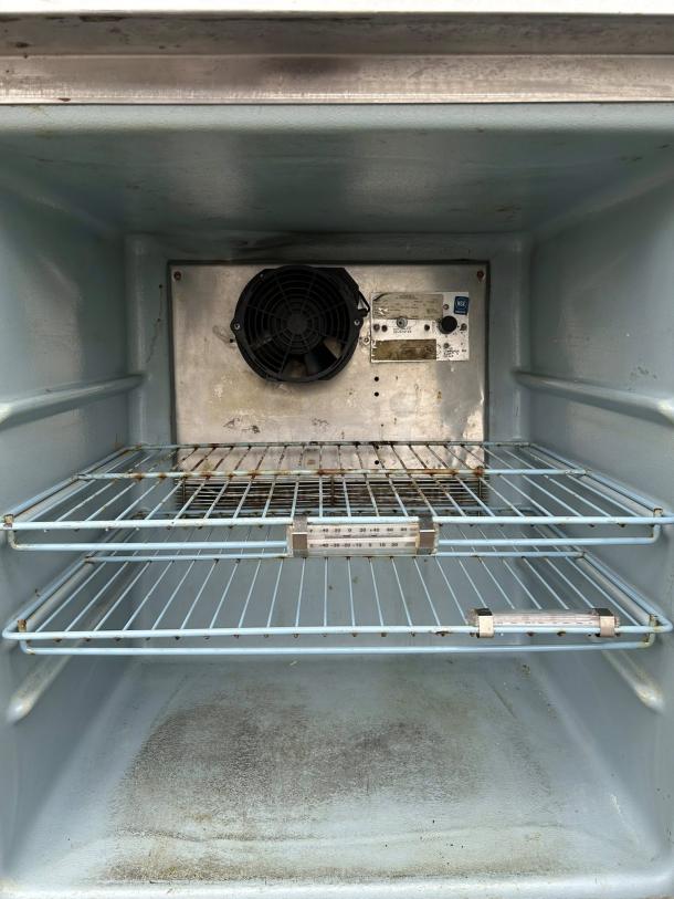 Delfield 407 undercounter freezer, single-section, 27"W, excellent condition, two wire shelves, tested and working.