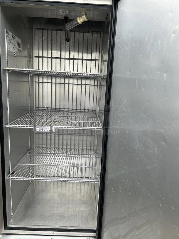 True T-23F-HC 27" reach-in freezer, stainless steel, single right-hinged door, three shelves, tested and working.