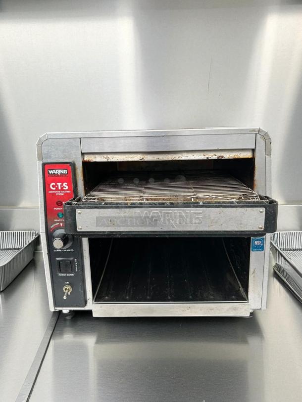 Waring CTS1000 commercial conveyor toaster, 120V, tested and working, visible controls and branding, NSF certified, good condition.