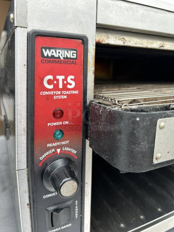 Waring CTS1000 commercial conveyor toaster, 120V, tested working, adjustable settings, minor wear, ideal for high-use environments.