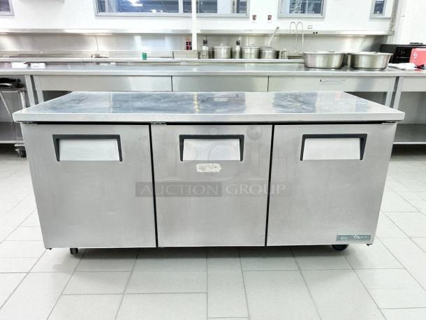 True TUC-72-HC undercounter refrigerator, 72"W, three sections, three doors, excellent condition, 115v, tested working.