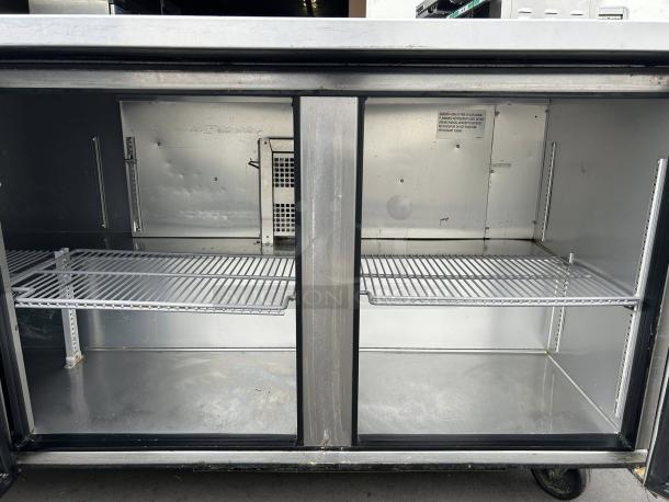 True TUC-72-HC 72" undercounter refrigerator with three sections and doors, excellent condition, interior view, tested and working.