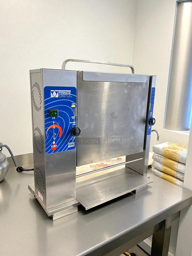 Prince Castle 297-T20 toaster in excellent condition, 1200 buns/hour, 115V, 1500W, with control panel and operational indicators.
