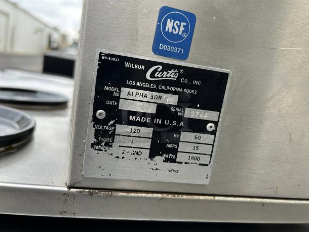 Curtis Alpha 3DR coffee brewer with 3 lower warmers, 120/220V, NSF certified, made in USA. Tested, great condition.