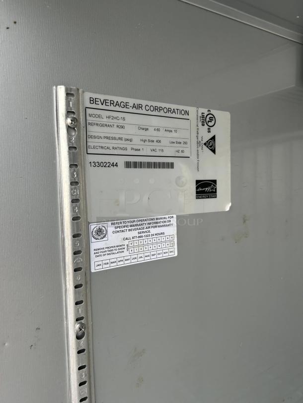 Beverage-Air HF2HC-1S label detailing model, refrigerant (R290), electrical ratings, and warranty info on a gray surface.