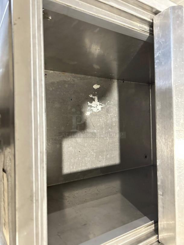 H&K 34" meat freezer, model 52473-1, tested and working, mild interior wear, stainless steel.