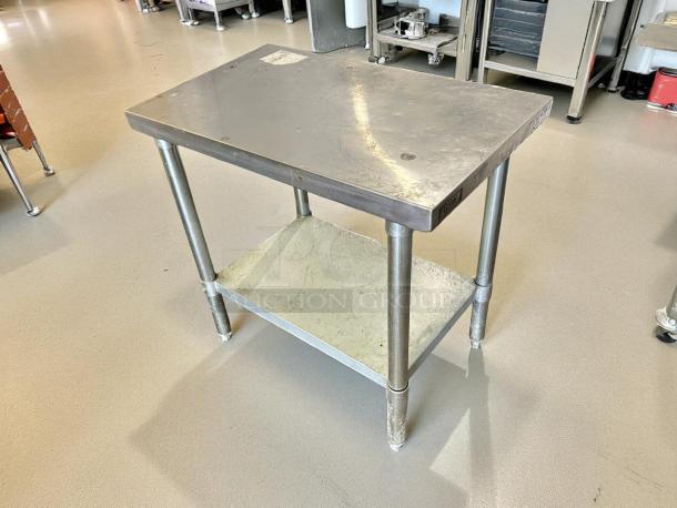 GSW 30” x 18” stainless steel worktop table in great condition, sturdy legs, lower shelf, and GSW brand marking.