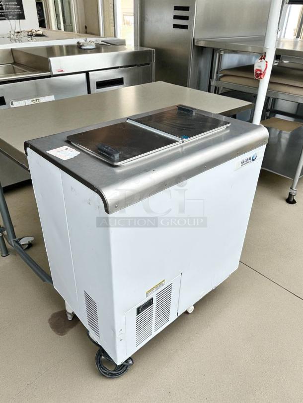 Global Refrigeration 30" ice cream chest cabinet in excellent condition, tested and working, with metal sliding lids.