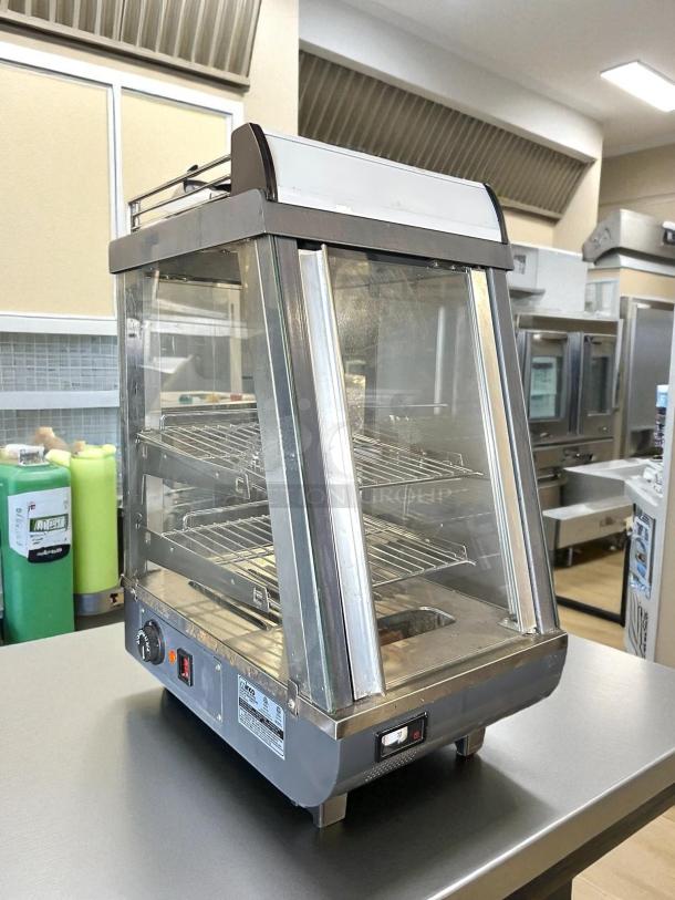 Winco HDM-13 heated display case, 13.5 inches, three shelves, tested and working. Countertop model, 120v, excellent condition.