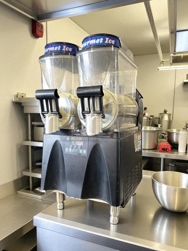 Bunn Ultra-N 2 Hopper Black Frozen Drink Machine, tested and working, with "Gourmet Ice" lids, in good condition.