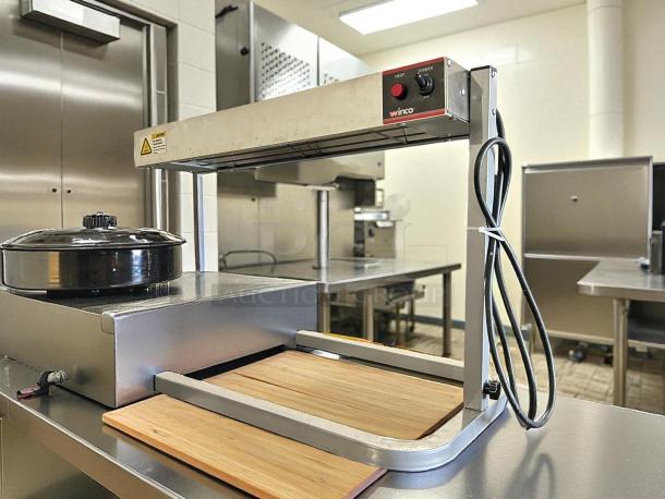 Winco ESH-1 14-Inch Strip Heater with adjustable stand in excellent condition, tested and working.
