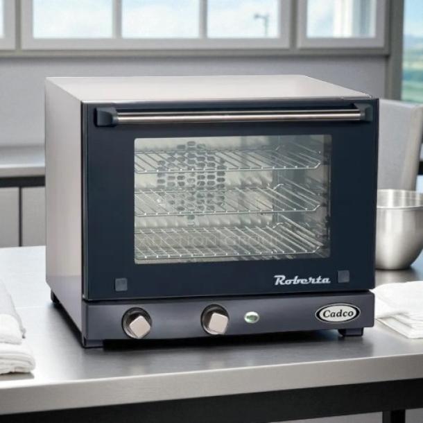 Cadco XA006 commercial convection oven, excellent condition, tested and working, features dual control knobs and spacious interior.