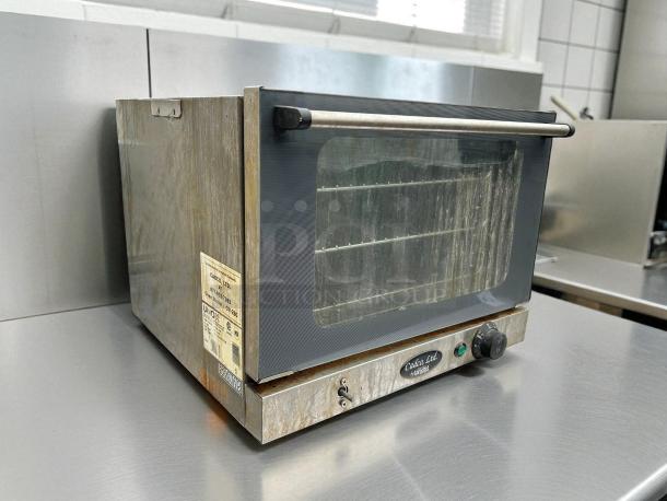 Cadco XA006 commercial convection oven, stainless steel, excellent condition, tested and working, visible control knob and door handle.
