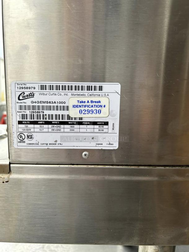 Curtis G4GEMS63A1000 9" stainless steel automatic coffee brewer; tested and working; model and identification tags visible.