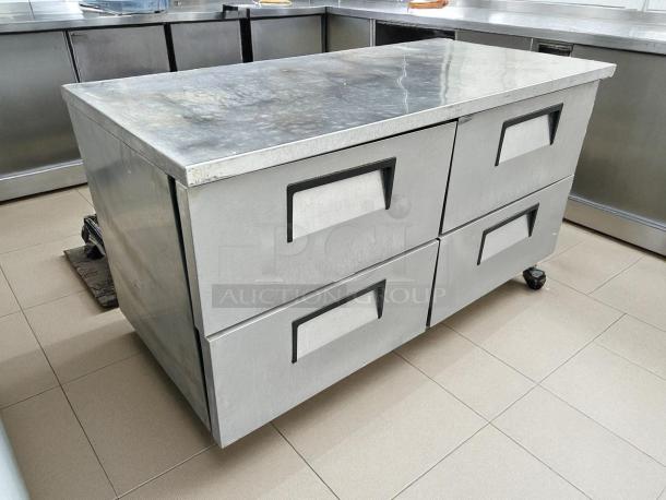 True TUC-60D-4-HC undercounter refrigerator with four drawers, stainless steel, tested and working, minor surface wear.