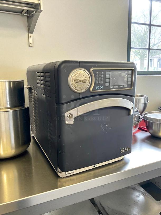 TurboChef NGO Rapid Cook Oven in excellent condition, tested and working. Black exterior with digital display and TurboChef logo.