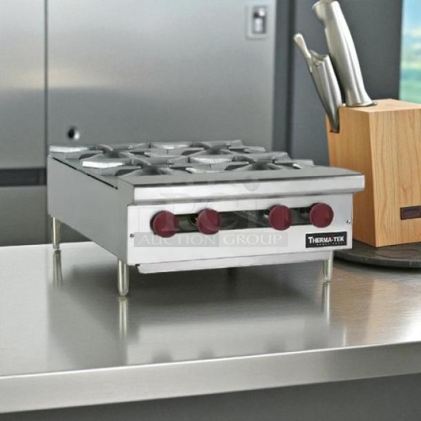 Therma-Tek TCHP24-4 burner countertop gas hotplate in original packaging, brand new with controls visible, stainless steel finish.