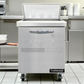 Continental SW27-12M sandwich prep unit, 27", 7.4 cu ft, stainless steel, tested and working, on casters, pristine condition.