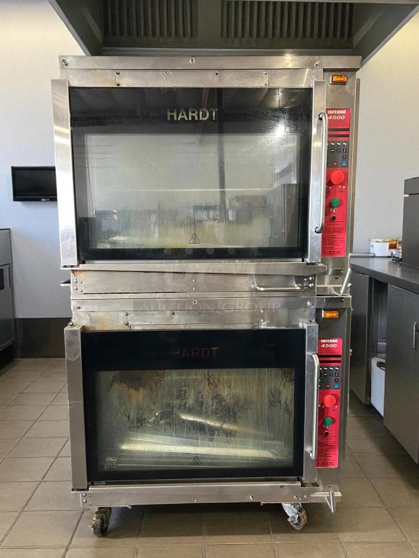 Hardt Inferno 4500 rotisserie oven, natural gas, excellent condition, stainless steel, dual glass doors, control panels visible.