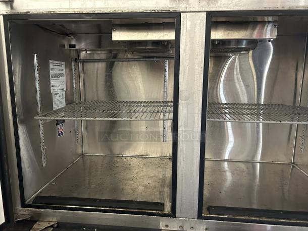 Glastender LP60 back bar cooler, dual glass doors, shelves shown. Stainless steel interior, tested and working.