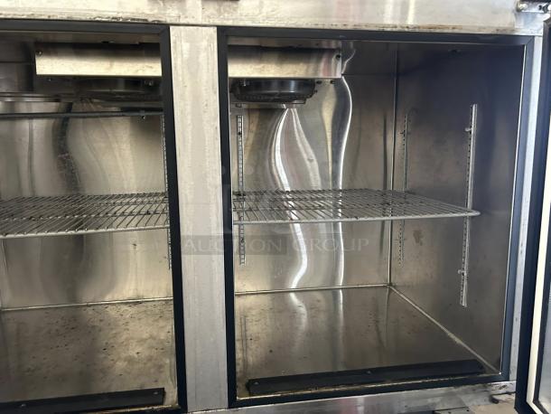 Glastender LP60-L1-XN(LR) 60" back bar cooler, two glass doors, tested, good condition, interior shelves visible.