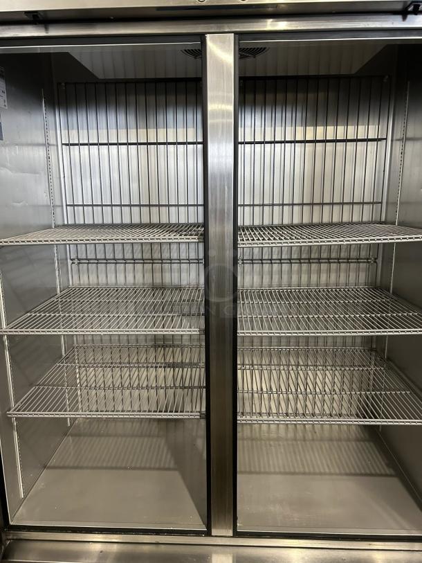 True T-49F-HC 49 Cu.Ft stainless reach-in freezer. Excellent condition, two-section, with shelves. Tested and working.