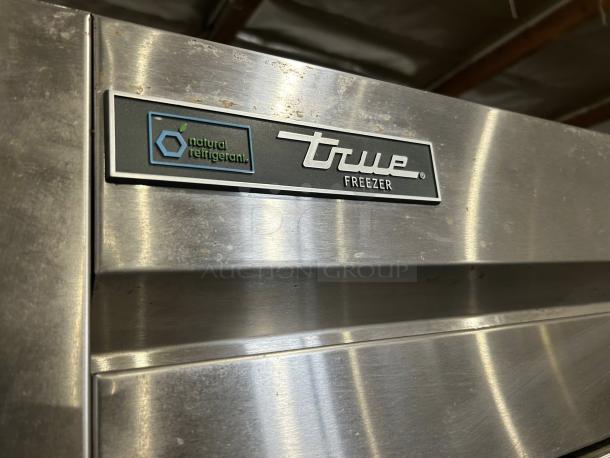 True T-49F-HC stainless steel reach-in freezer in excellent condition, 49 cu. ft. capacity, with natural refrigerant label.