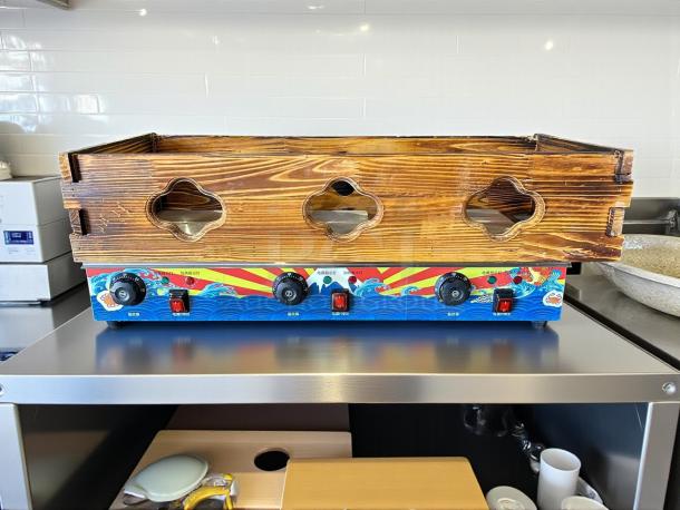 Commercial Kanto cooker in great condition with wooden exterior, colorful control panel, 115v electric, ideal for hot pot and noodles.