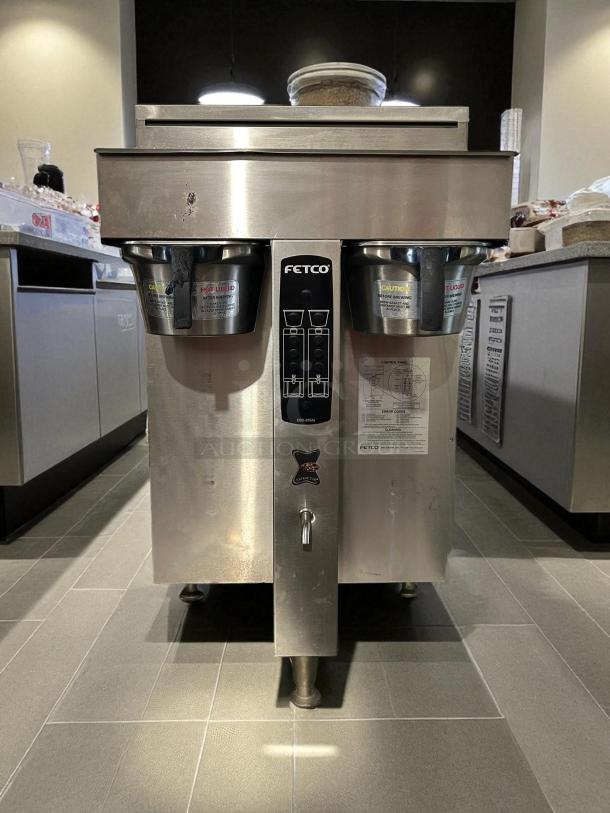 Fetco CBS-2052e dual station coffee brewer, stainless steel, fully tested, excellent condition, 208-240V, visible caution labels.