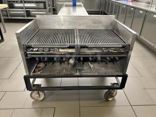 Heavy-duty 10-burner gas grill, tested and working. Features dual grates, sturdy metal construction, and large wheels for mobility.
