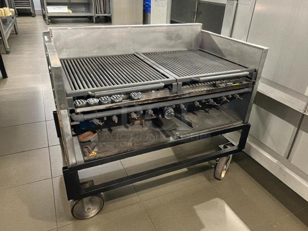 Heavy duty gas grill with 10 burners, stainless steel, tested and working, on wheels for mobility, good condition.