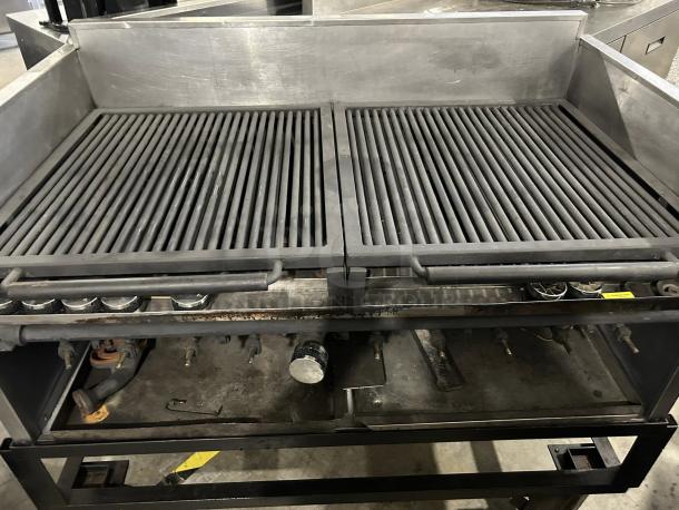 Heavy-duty 10-burner gas grill, stainless steel, tested and working condition. Features robust construction and spacious cooking surface.