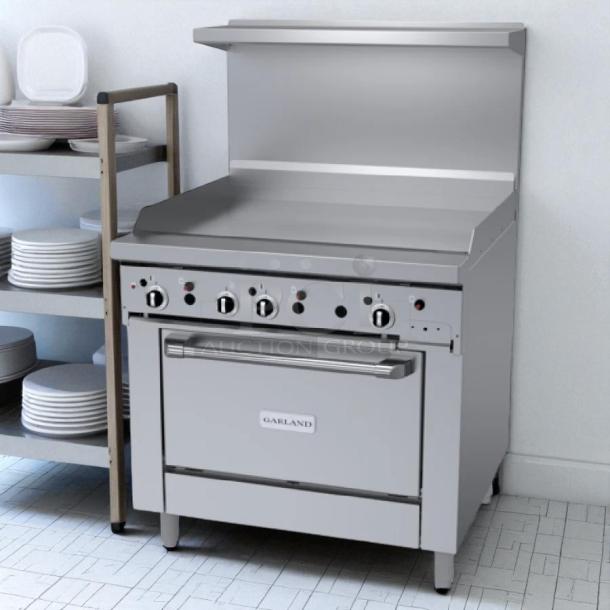 Garland M48R 34" gas range with full griddle and standard oven, in excellent condition, tested and working, natural gas.
