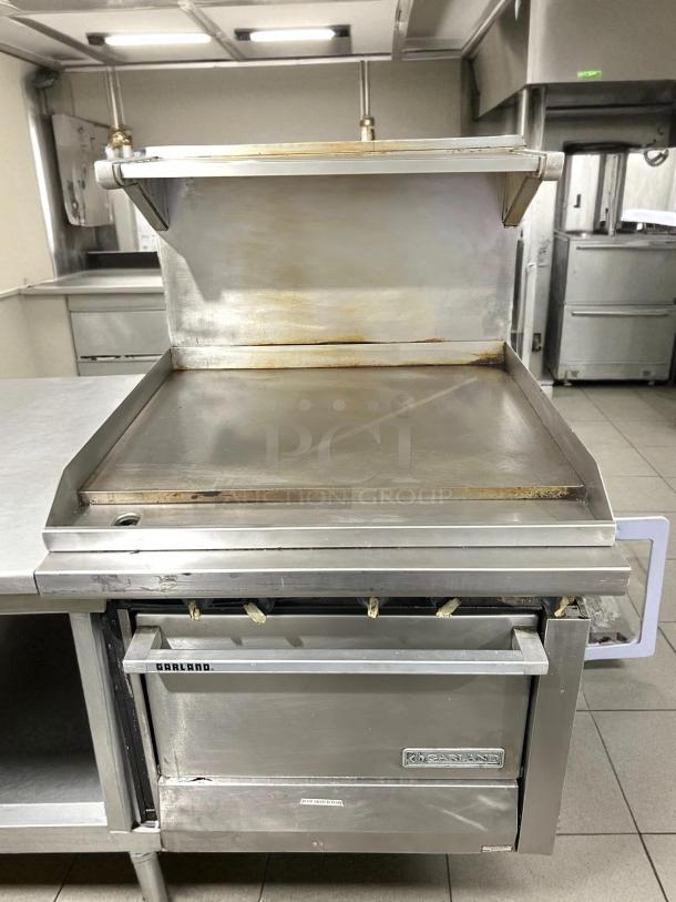 Garland M48R 34" gas range with full griddle and standard oven, in excellent condition. Natural gas, tested and working.