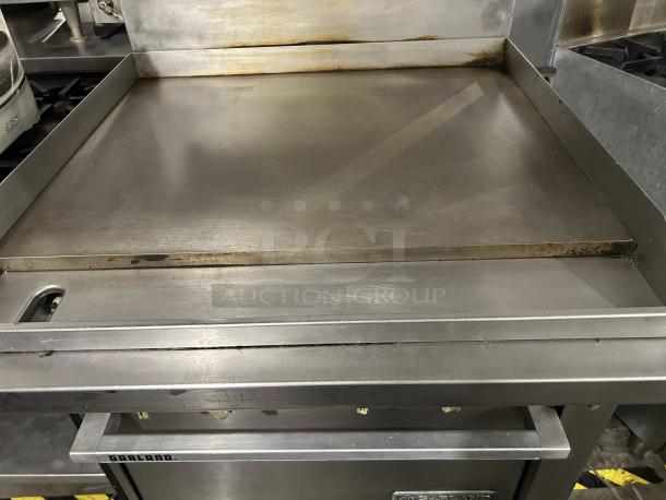 Garland M48R 34" gas range with full griddle and standard oven. Stainless steel, excellent condition, natural gas, tested and working.