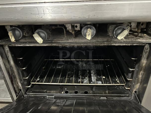 Garland M48R 34" gas range with full griddle and standard oven, natural gas, excellent condition, tested working.