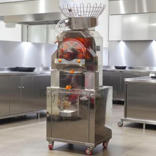 Citrocasa 8000 SB Citrus Juicer, stainless steel, tested and working, large orange feed basket, professional kitchen setting.