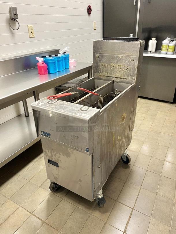 Pitco SG14T-S gas fryer, excellent condition, two 25 lb vats, floor model, natural gas, tested and working, visible wear.